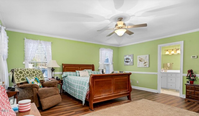 bedroom featuring ceiling fan, dark hardwood / wood-style flooring, ornamental molding, and connected bathroom