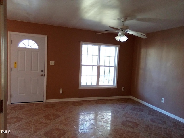 entryway with tile patterned flooring and ceiling fan