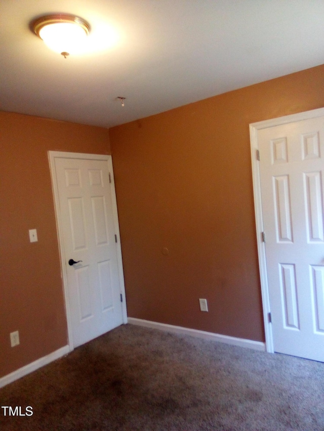 empty room featuring carpet flooring