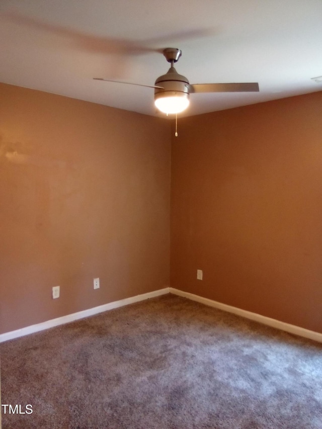 empty room with ceiling fan and carpet flooring