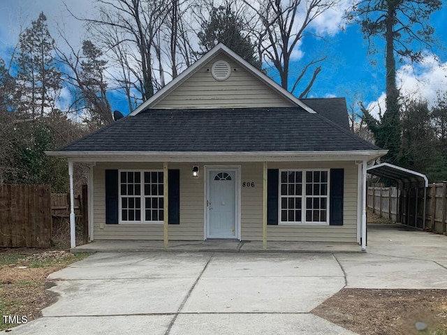 bungalow-style house featuring a carport