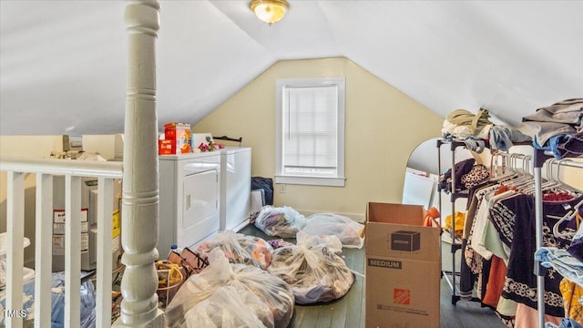 bonus room with washer and dryer, lofted ceiling, and wood-type flooring