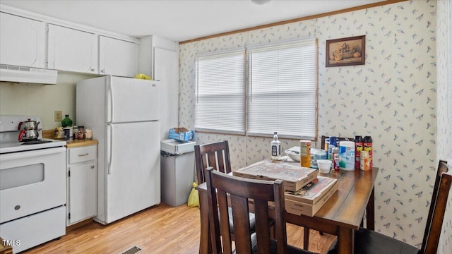 dining room featuring light wood-type flooring