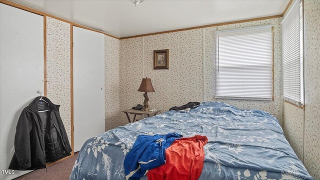 bedroom with crown molding