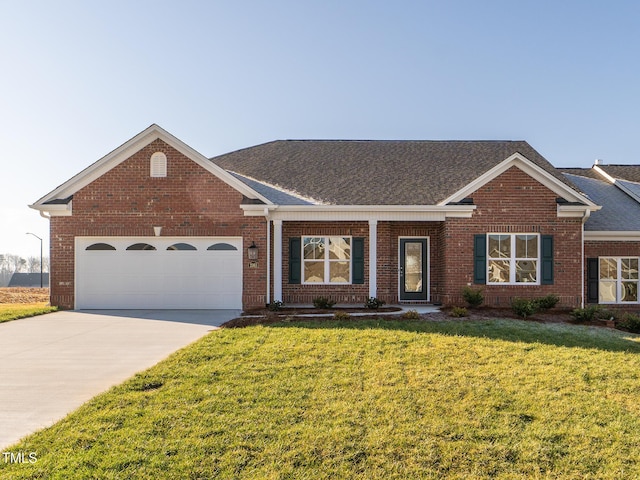 view of front facade with a front yard and a garage