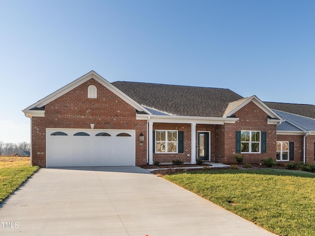 ranch-style house with a garage and a front yard