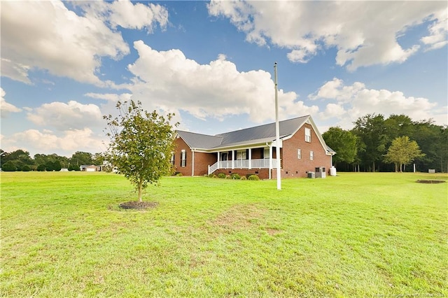 exterior space with a yard and a porch