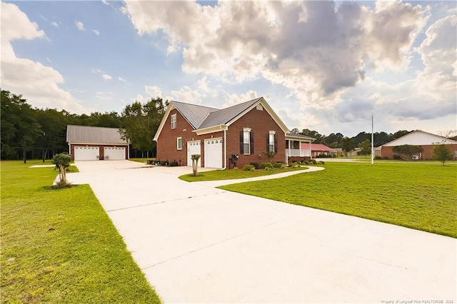 ranch-style house featuring a front lawn and a garage