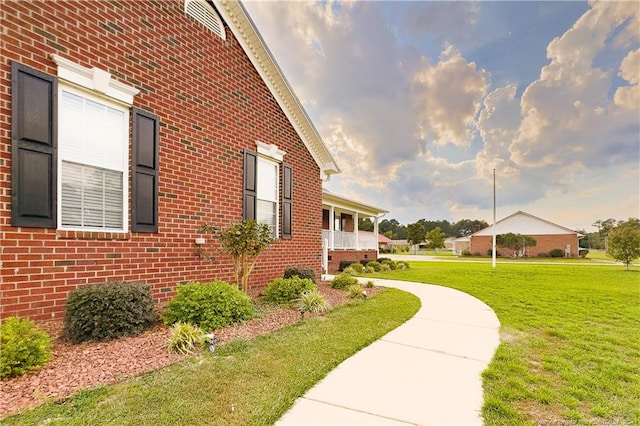 view of home's exterior with a lawn