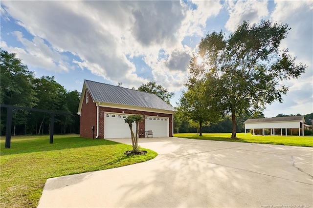 exterior space featuring a lawn and a garage