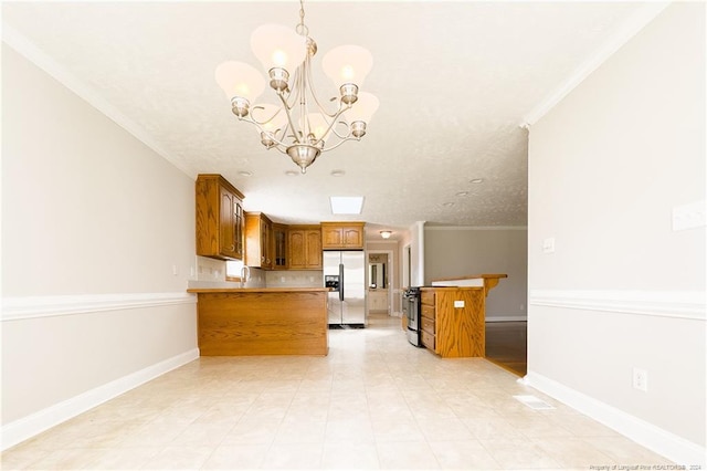 kitchen with pendant lighting, ornamental molding, appliances with stainless steel finishes, kitchen peninsula, and a chandelier