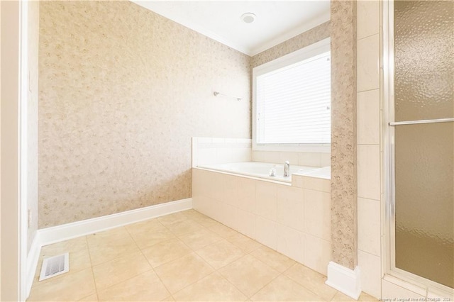 bathroom featuring tile patterned floors and shower with separate bathtub