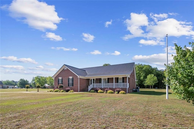 4419 Cameron Rd, Hope Mills, NC 28348 - view of front of property with covered porch, brick siding, and a front lawn