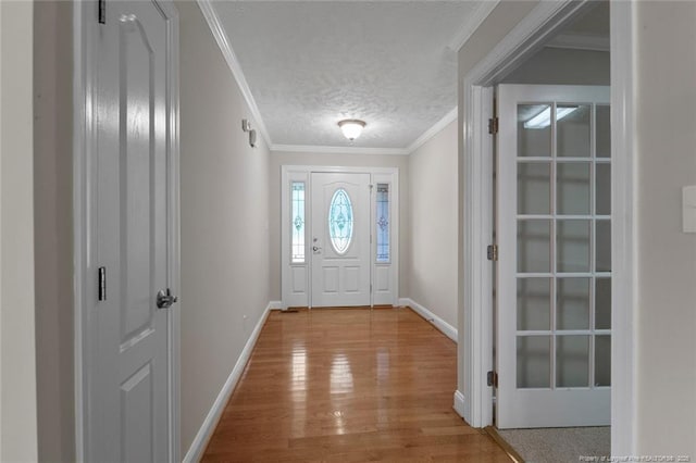 4419 Cameron Rd, Hope Mills, NC 28348 - foyer entrance featuring wood finished floors, a textured ceiling, and crown molding