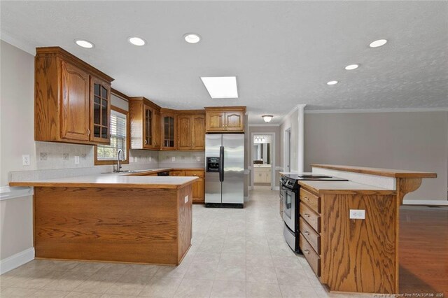 4419 Cameron Rd, Hope Mills, NC 28348 - kitchen with stainless steel fridge with ice dispenser, range with electric stovetop, brown cabinets, glass insert cabinets, and crown molding