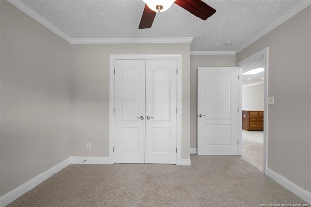 4419 Cameron Rd, Hope Mills, NC 28348 - unfurnished bedroom featuring a closet, carpet flooring, crown molding, and a ceiling fan