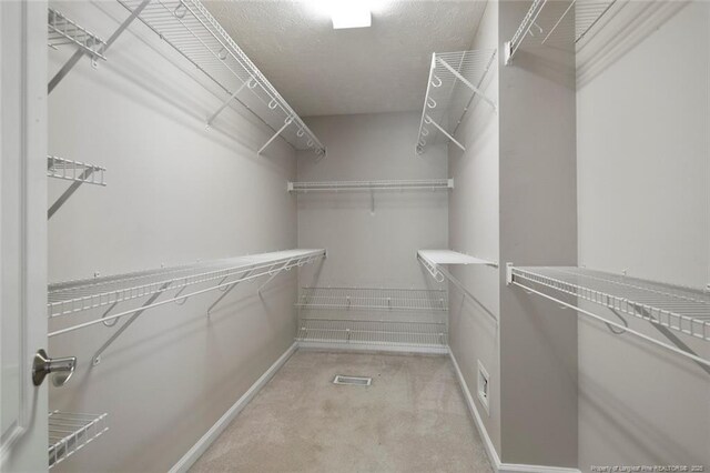 4419 Cameron Rd, Hope Mills, NC 28348 - walk in closet featuring light colored carpet