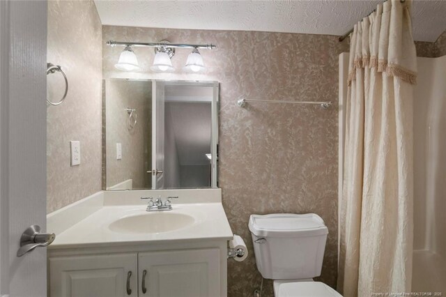 4419 Cameron Rd, Hope Mills, NC 28348 - bathroom with wallpapered walls, vanity, a textured ceiling, and a shower with curtain