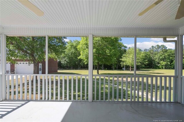 4419 Cameron Rd, Hope Mills, NC 28348 - unfurnished sunroom with a ceiling fan and view of scattered trees