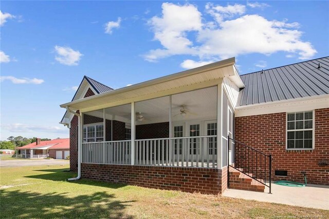 4419 Cameron Rd, Hope Mills, NC 28348 - rear view of property with a ceiling fan, a metal roof, brick siding, a yard, and crawl space
