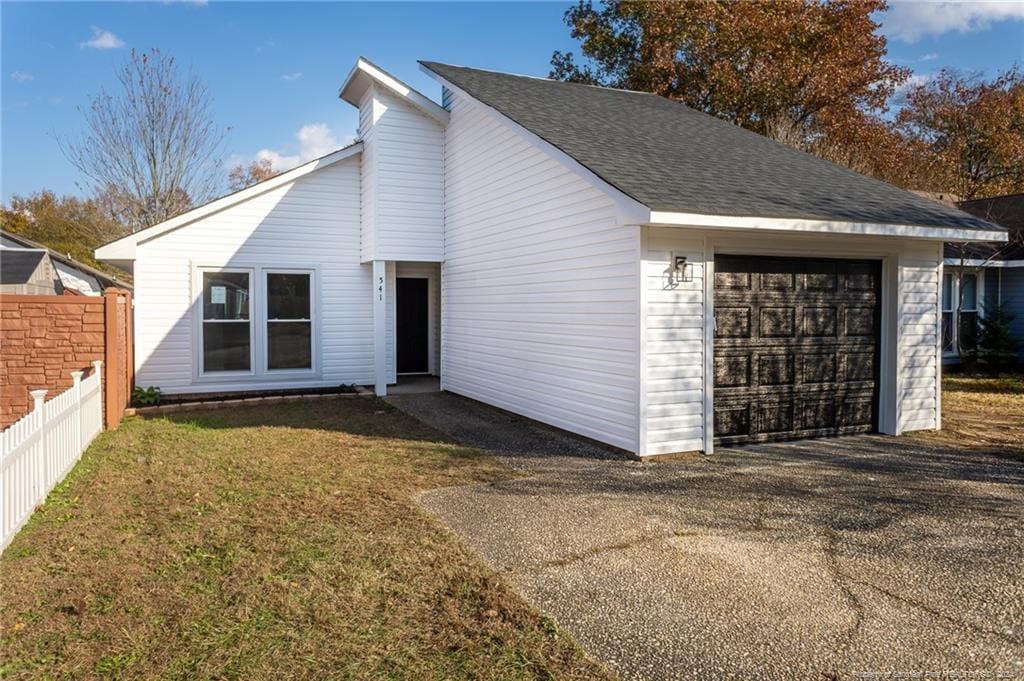 view of front of home with a front lawn