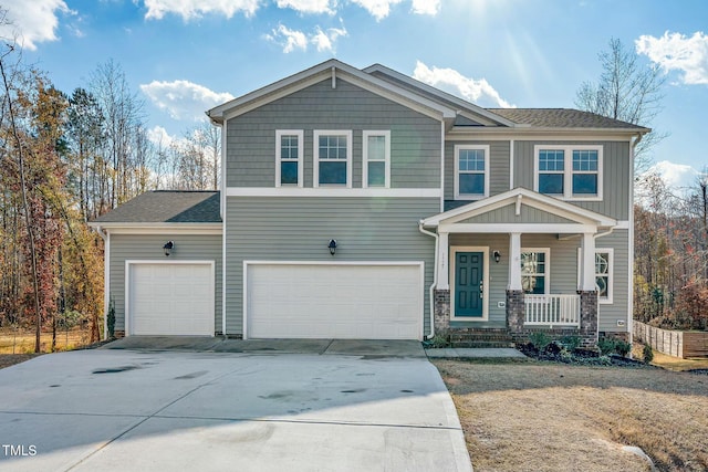 view of front of house with a porch and a garage