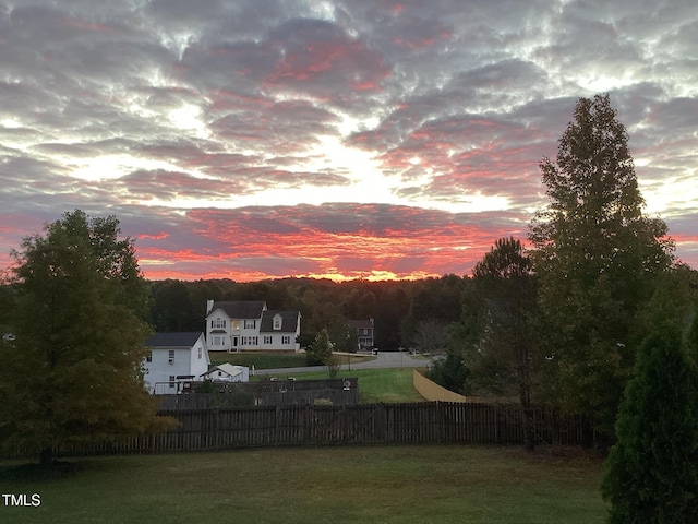 view of yard at dusk