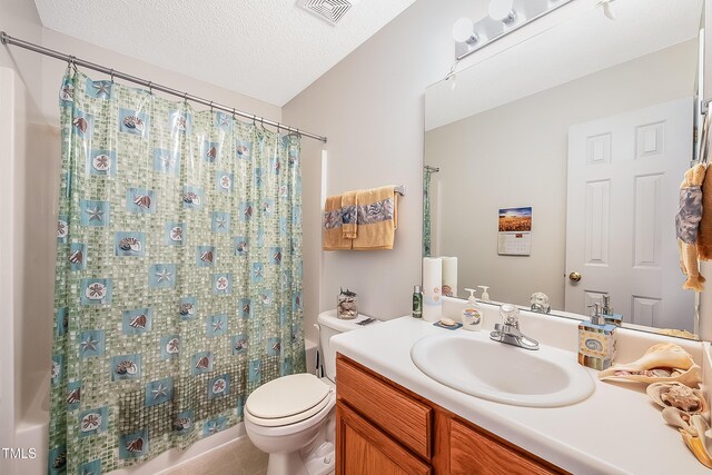 full bathroom with tile patterned floors, a textured ceiling, toilet, vanity, and shower / tub combo