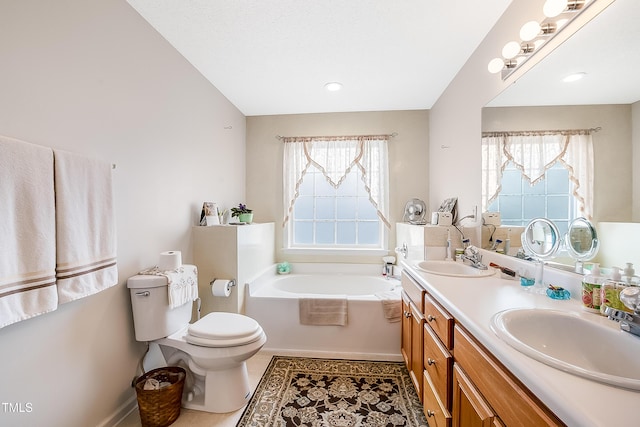 bathroom with a tub to relax in, a wealth of natural light, tile patterned floors, and vanity