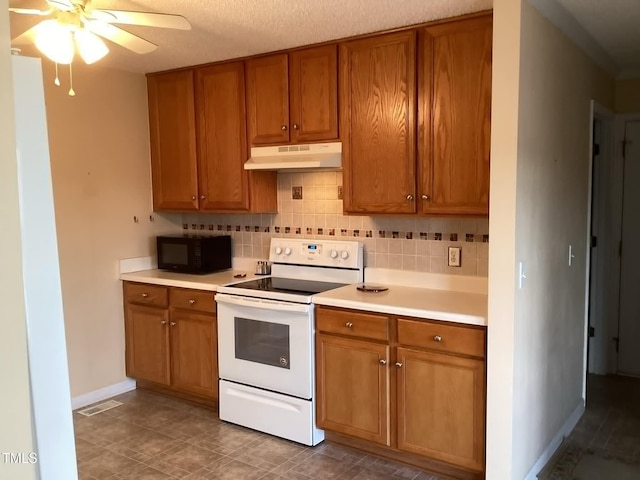 kitchen with white electric range oven, ceiling fan, decorative backsplash, and a textured ceiling