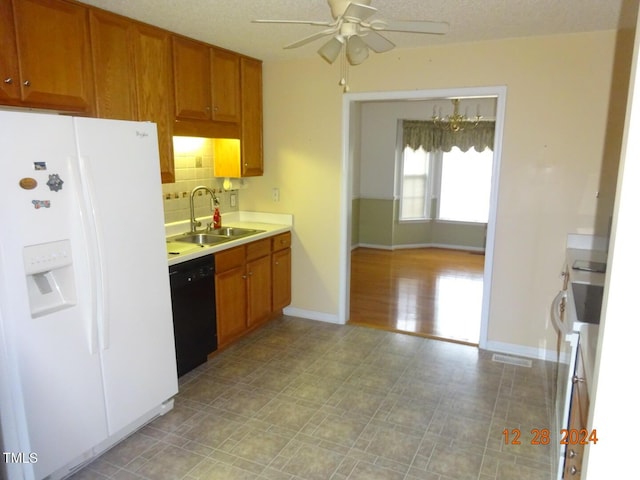 kitchen featuring white refrigerator with ice dispenser, sink, a textured ceiling, black dishwasher, and tasteful backsplash