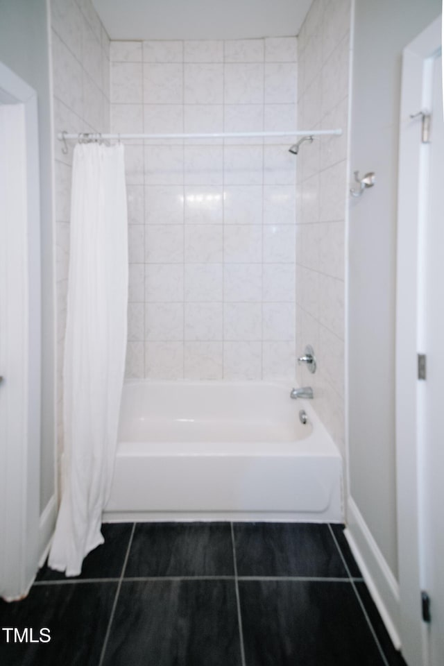 bathroom featuring tile patterned flooring and shower / bath combo with shower curtain