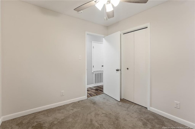 unfurnished bedroom featuring ceiling fan, a closet, and carpet floors
