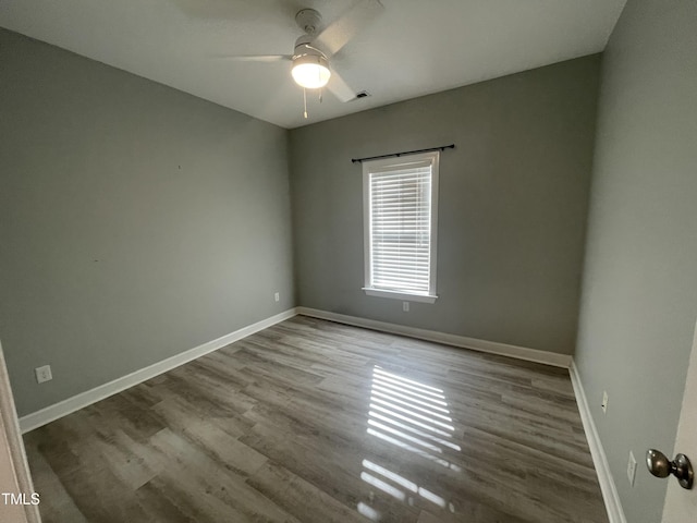 unfurnished room with ceiling fan and light wood-type flooring