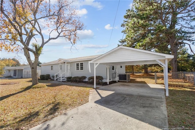 view of front of house with cooling unit and a carport