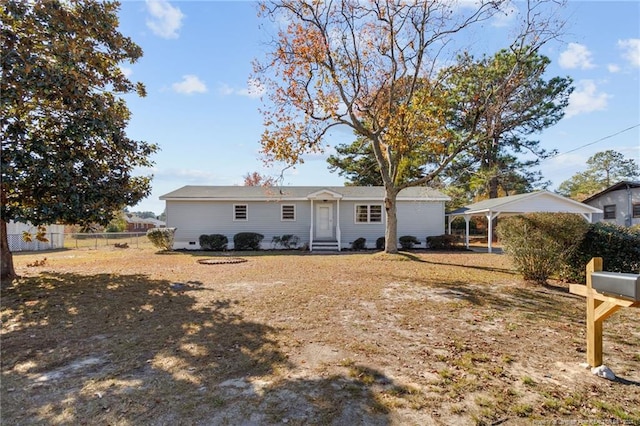 rear view of house featuring a carport