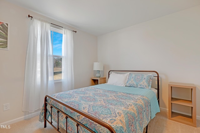 bedroom with light colored carpet