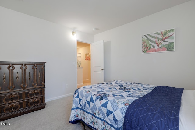 bedroom featuring light colored carpet