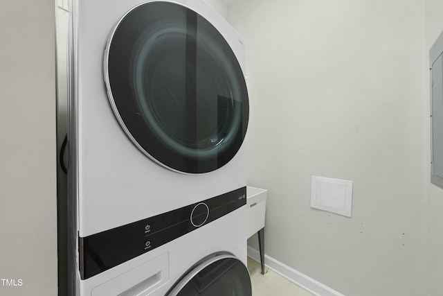 washroom with stacked washer / dryer