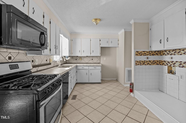 kitchen featuring backsplash, black appliances, white cabinets, sink, and ornamental molding