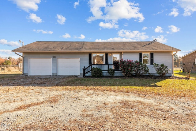 single story home featuring a garage and a front yard