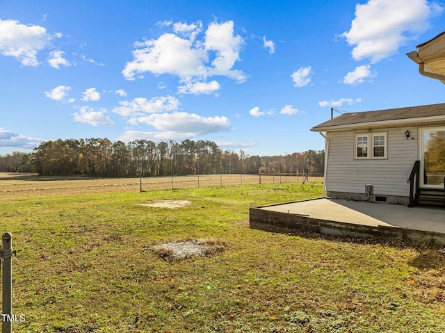 view of yard featuring a rural view and a patio area