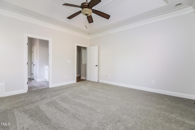 carpeted empty room with ceiling fan and ornamental molding