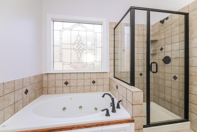 bathroom with plenty of natural light and independent shower and bath