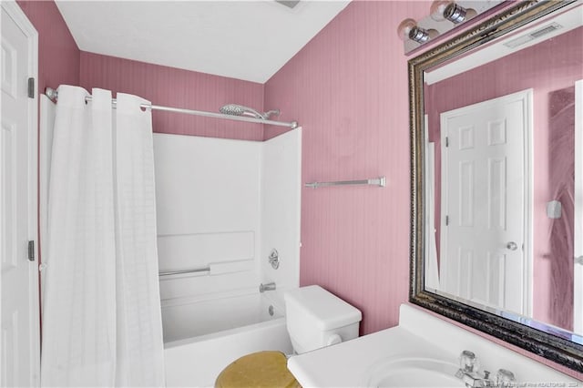 full bathroom featuring shower / bath combination with curtain, vanity, and toilet