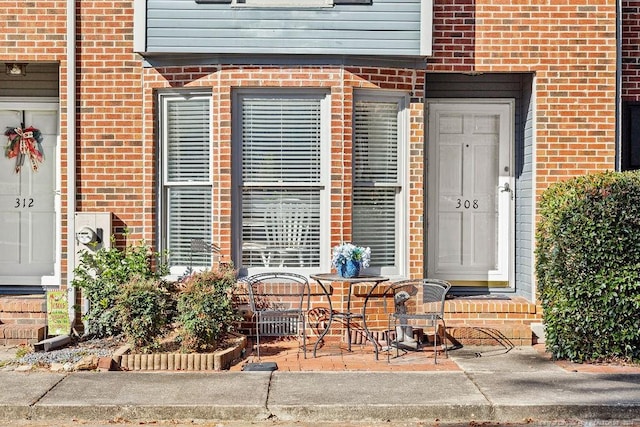 property entrance with a patio