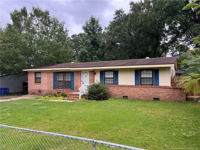 ranch-style home with a front lawn