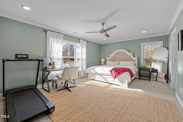 bedroom with ceiling fan, crown molding, and light carpet