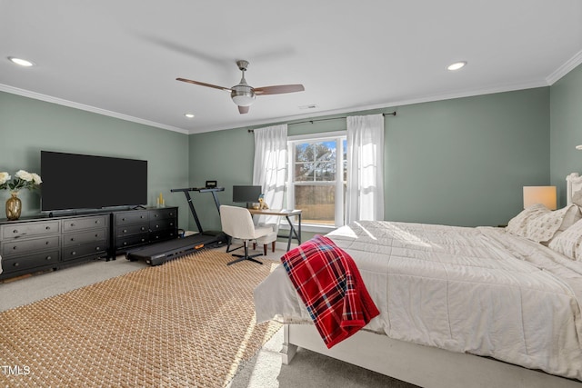 carpeted bedroom with ceiling fan and ornamental molding