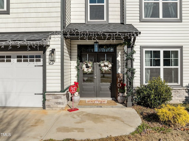 view of exterior entry featuring french doors